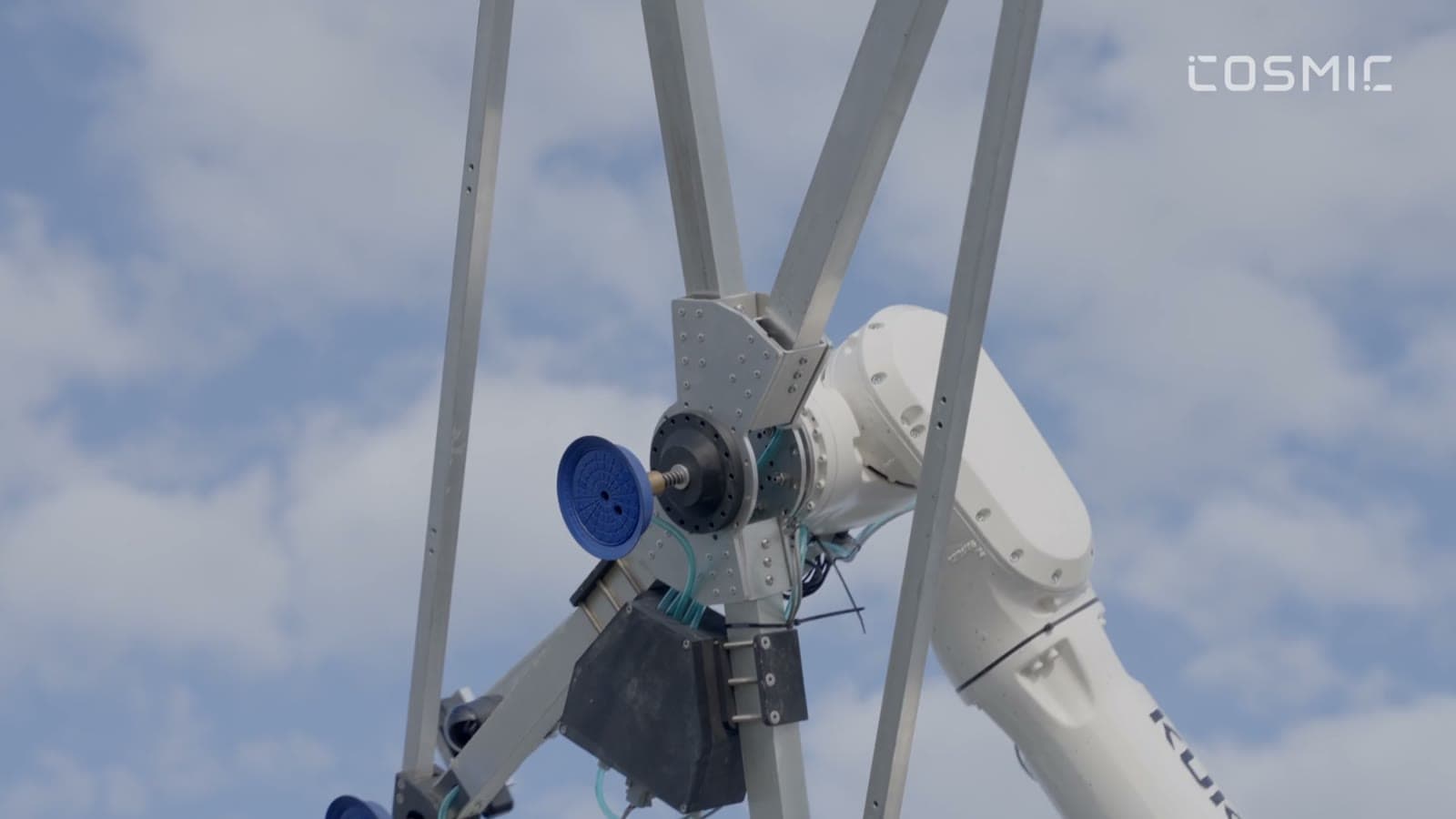 Cosmic-1 robotic arm against the sky, from the launch film