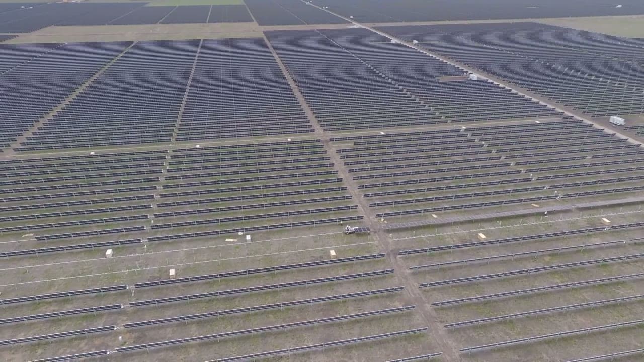 Aerial view of a utility-scale solar field under construction